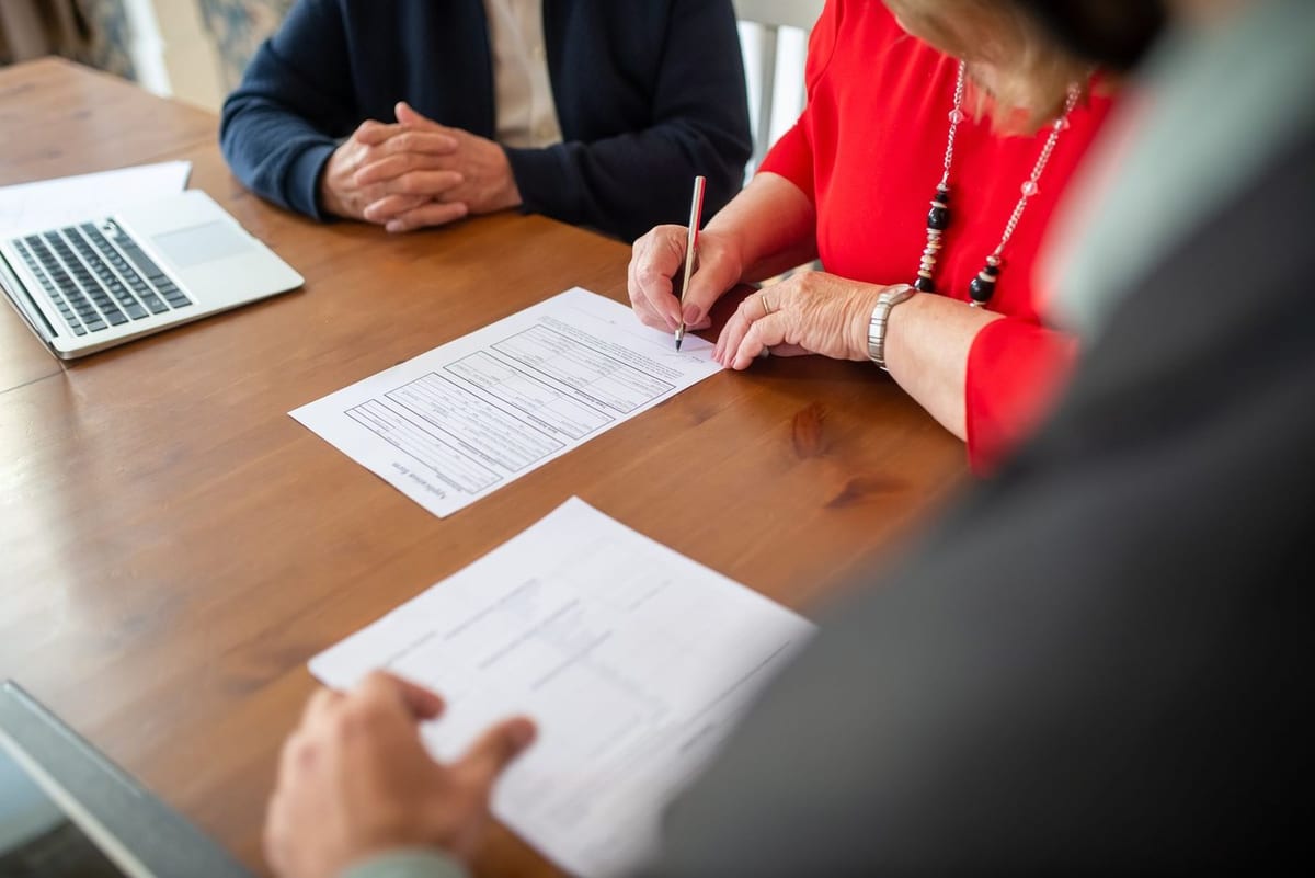 A client signing paperwork